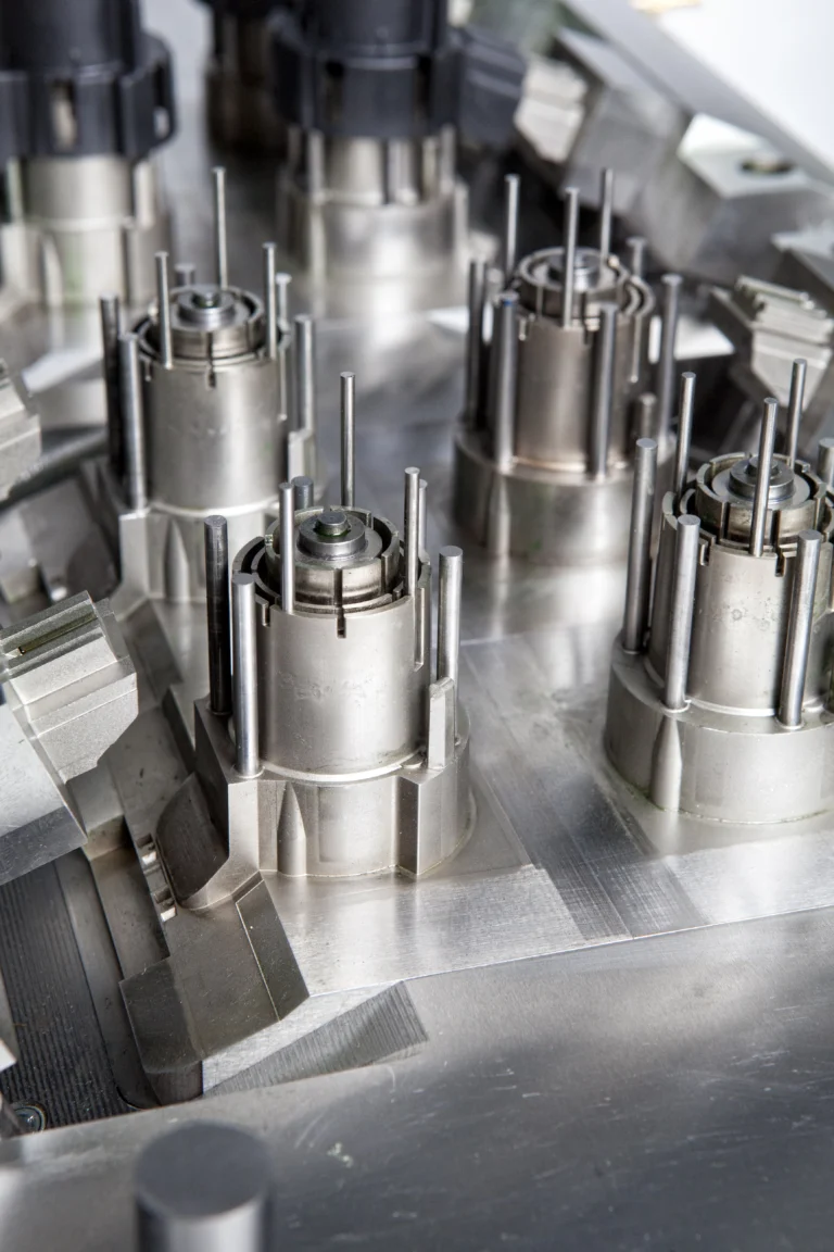 up close image of precision cap mold component cores with ejectors pulled.