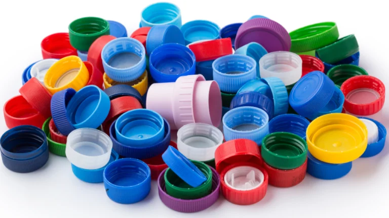 Colorful plastic bottle caps scattered randomly.