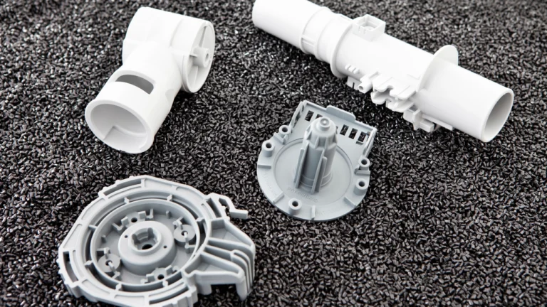 Various white plastic components on surface