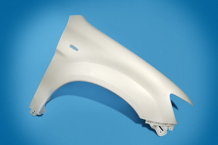 Injection molded automotive fender, hot runner vs cold runner mold output